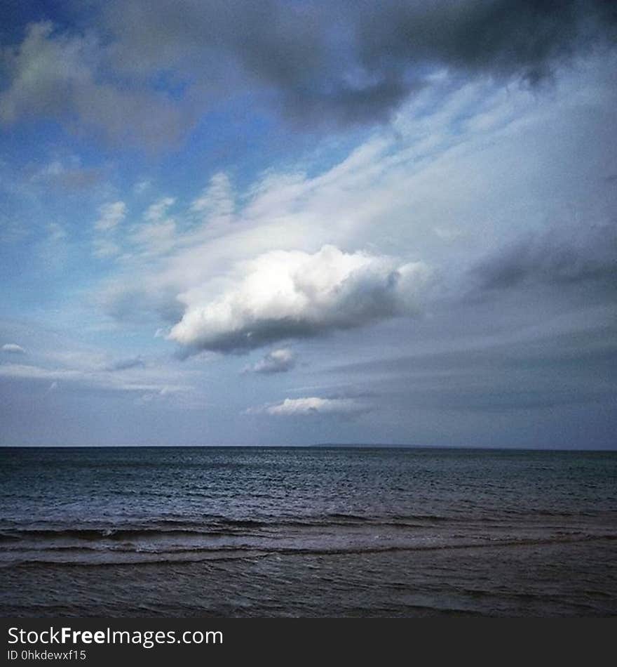 Open sea and clouds in the sky.