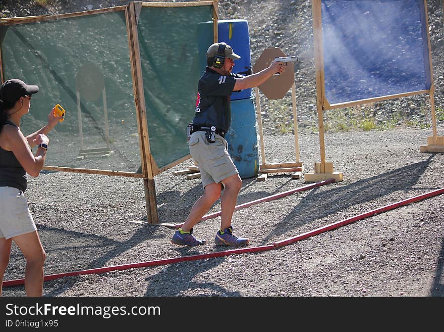 A person practices at a shooting range.