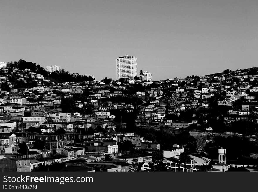 Aerial view of roof tops in hillside town in black and white. Aerial view of roof tops in hillside town in black and white.