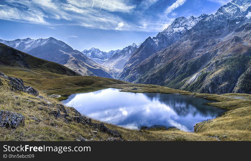 Alpine lake reflecting surrounding peaks in Briancon K5. Alpine lake reflecting surrounding peaks in Briancon K5.