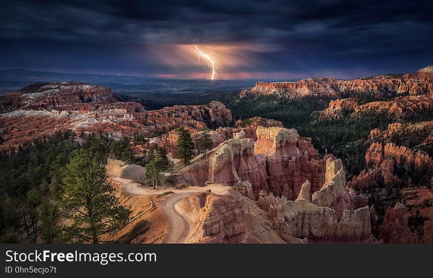 A lightning bolt strikes over a canyon. A lightning bolt strikes over a canyon.