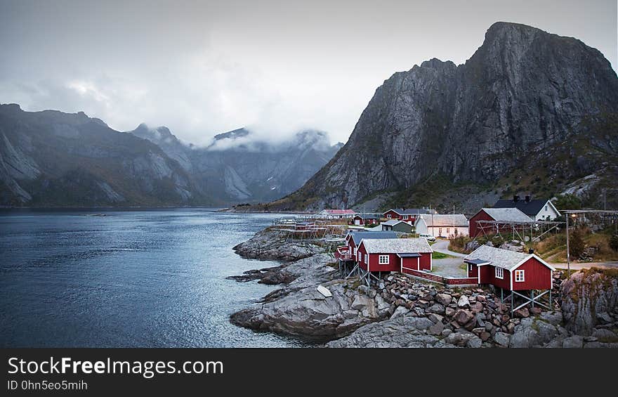 A tiny fjord village next to the water.