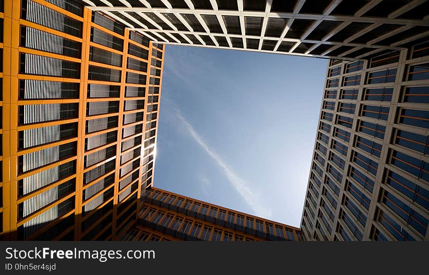 Exterior of contemporary architecture with open blue skies on sunny day. Exterior of contemporary architecture with open blue skies on sunny day.