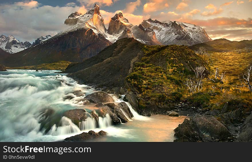 Waterfalls in valley of mountain landscape at sunset. Waterfalls in valley of mountain landscape at sunset.