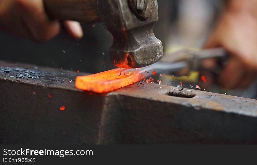 Forging hot iron