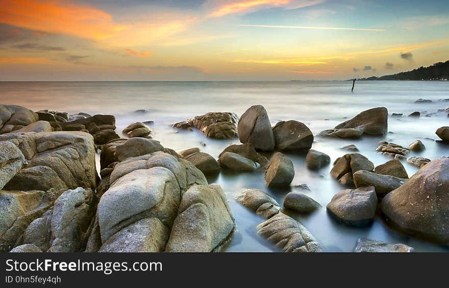 Rocks on a beach at dusk. Rocks on a beach at dusk.