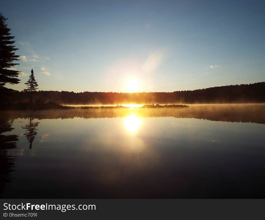 Morning sun reflected off Pog Lake. Morning sun reflected off Pog Lake