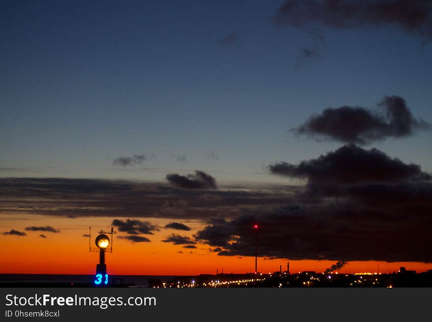 Glorious colors painted over Cleveland. That smoke plume makes the cloud look a bit like a funnel cloud &#x28;it&#x27;s not&#x29;. Glorious colors painted over Cleveland. That smoke plume makes the cloud look a bit like a funnel cloud &#x28;it&#x27;s not&#x29;