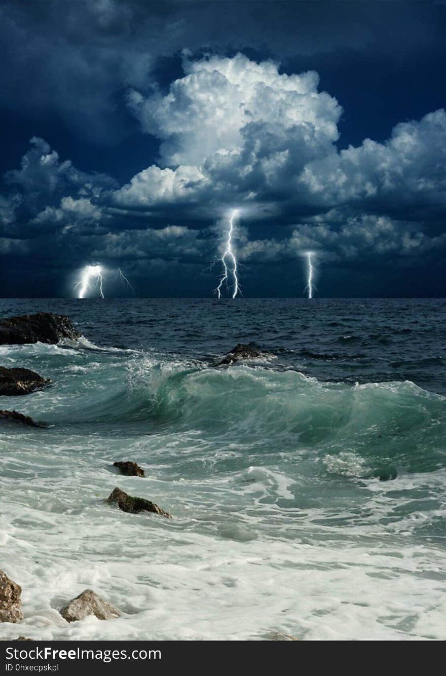 A storm with lightning above the sea. A storm with lightning above the sea.