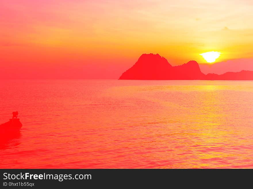 Bright colors at dawn on the beach at sunrise in the Gulf of Thailand.