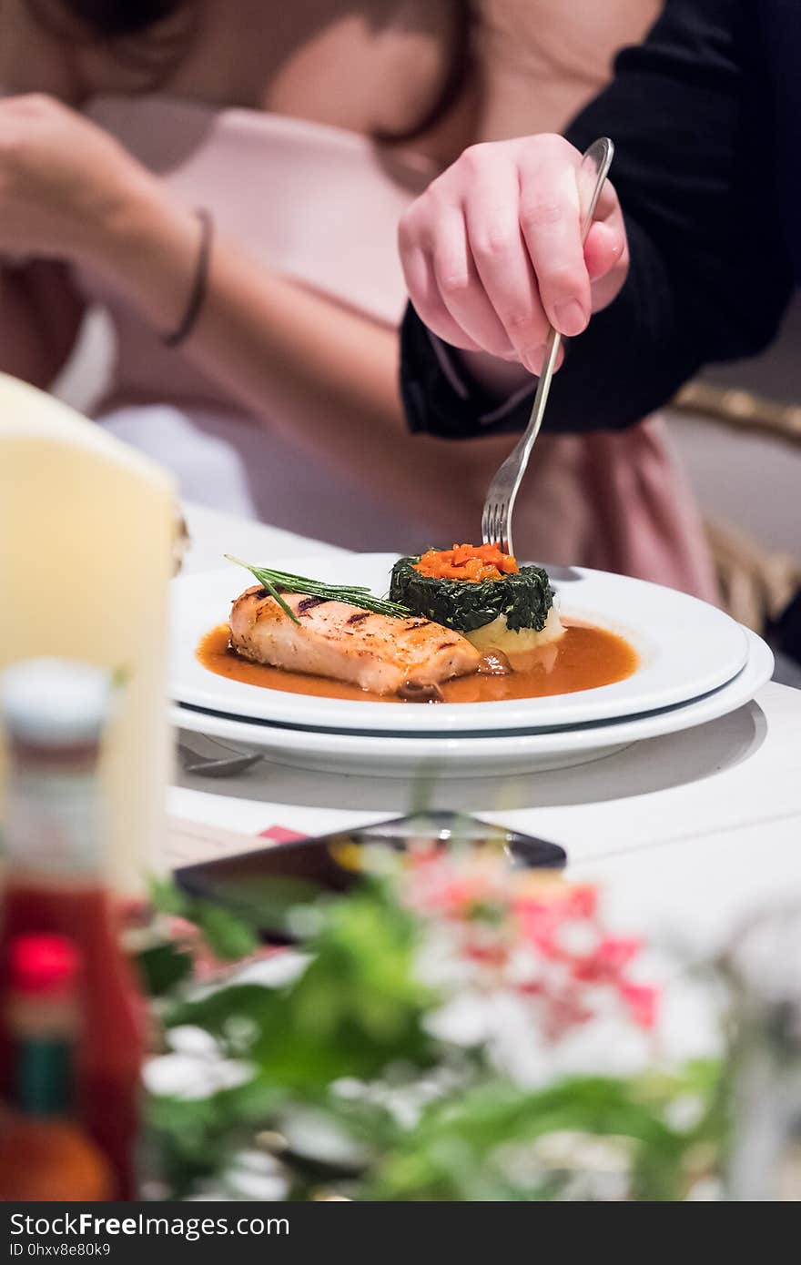 Cropped image of man eating in restaurant