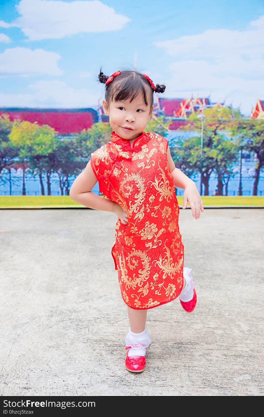 Girl in traditional chinese costume with funny face