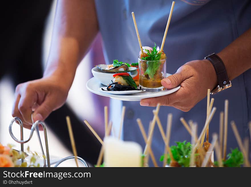 Catering - food, plate and hand