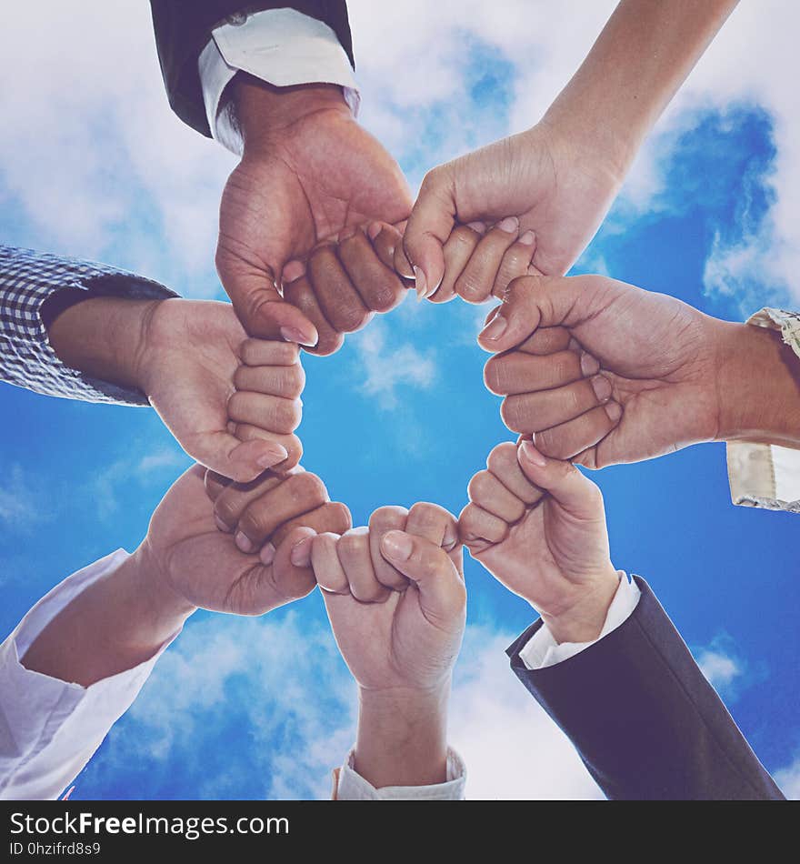 Diverse People Hands Fists Together Partnership.