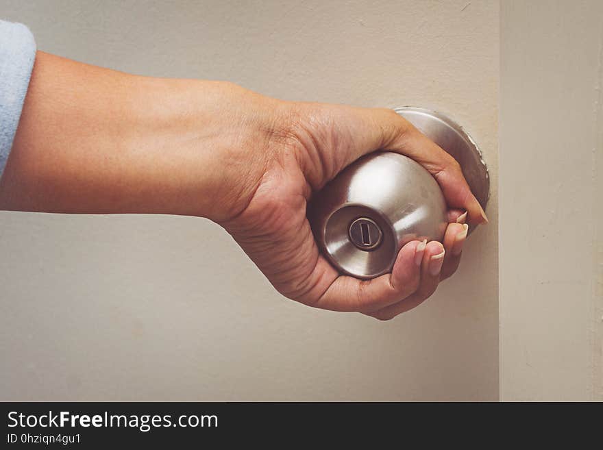 Asian Women Hand Open Door Knob