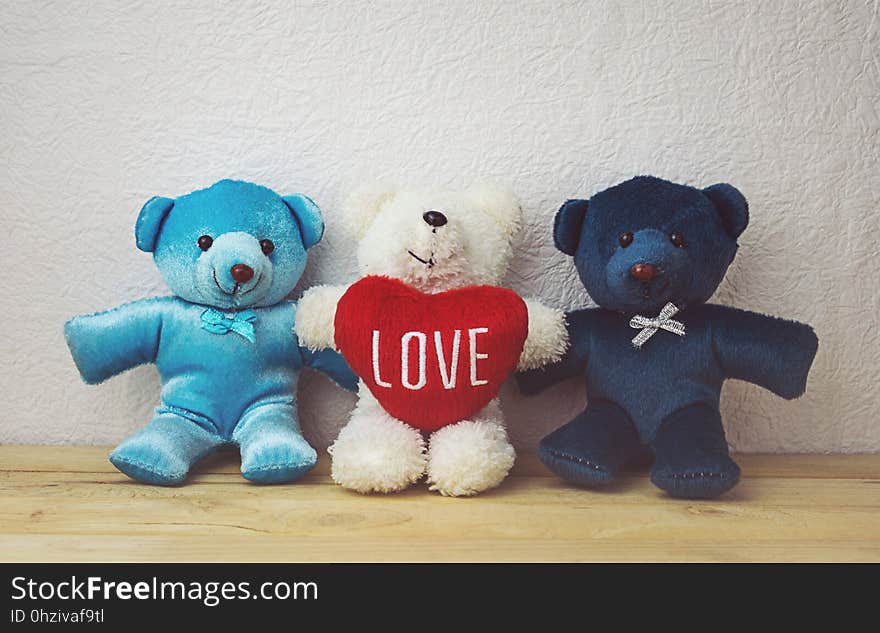 Lovely Teddy Bear And Red Heart Shape Sitting On Wood Table