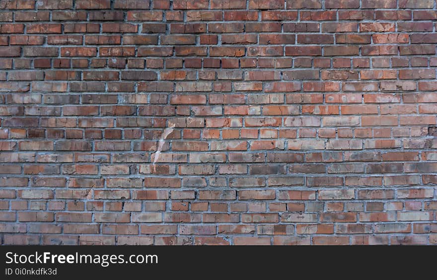 Texture of the collapsing wall of red brick burnt over time. Texture of the collapsing wall of red brick burnt over time