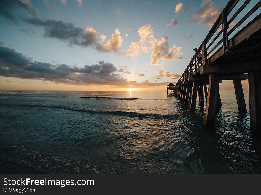 Scenic View of Sea Against Sky at Sunset