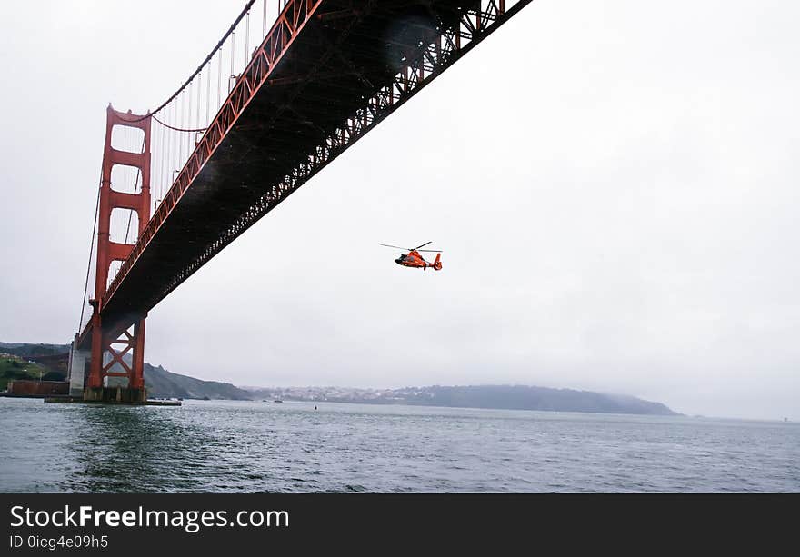 Rescue Helicopter Flying Under Golden Gate Bridge