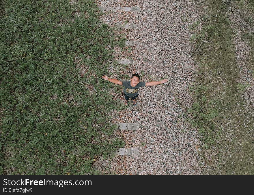 Aerial View Of Man In Grey Top And Black Pants Standing