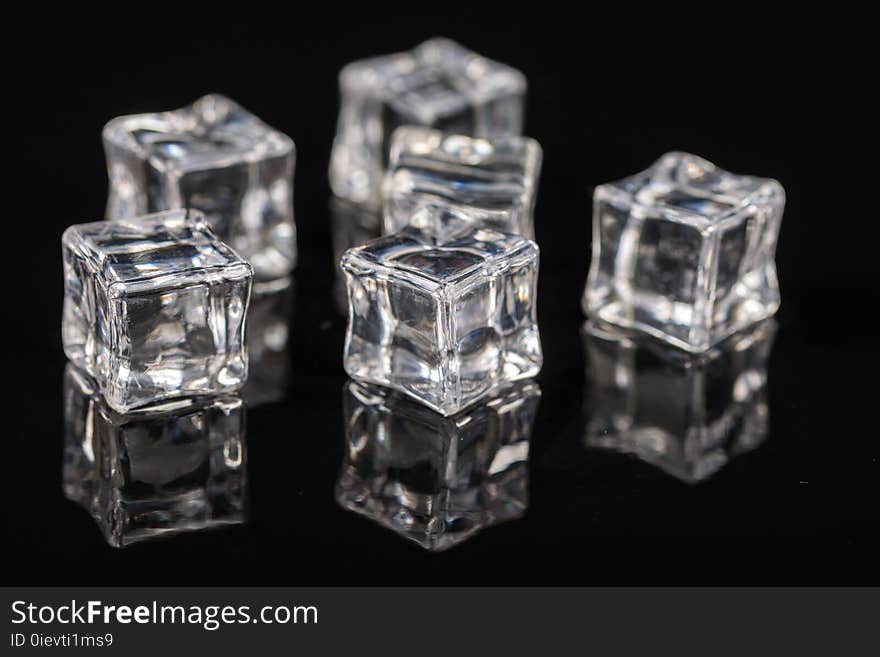 Ice Cubes On The Black Background With Reflections