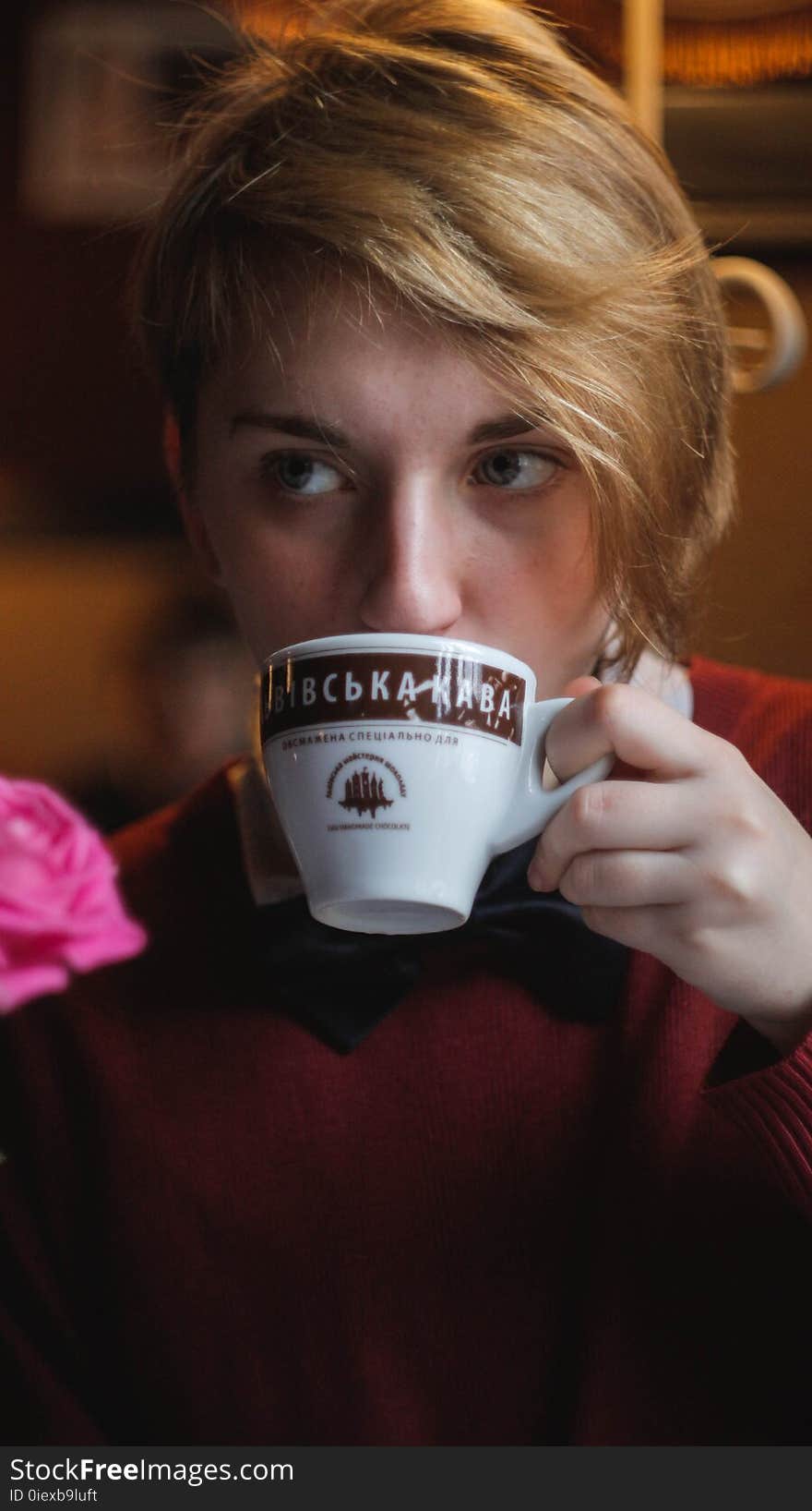 Woman Wearing Red Top Holding Teacup