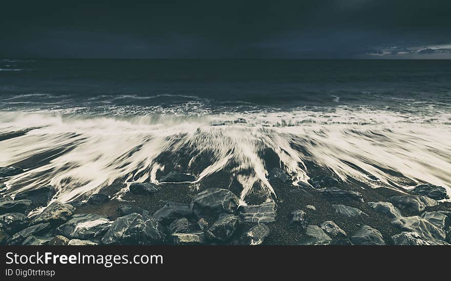 Dramatic Ocean Waves Crashing on Rocky Beach