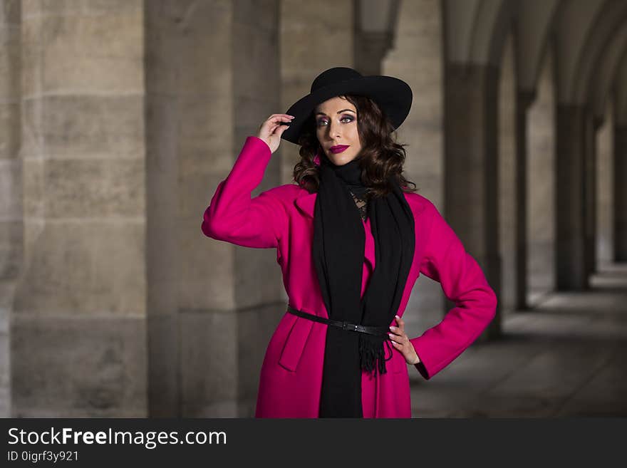 Portrait of an attractive woman in pink coat