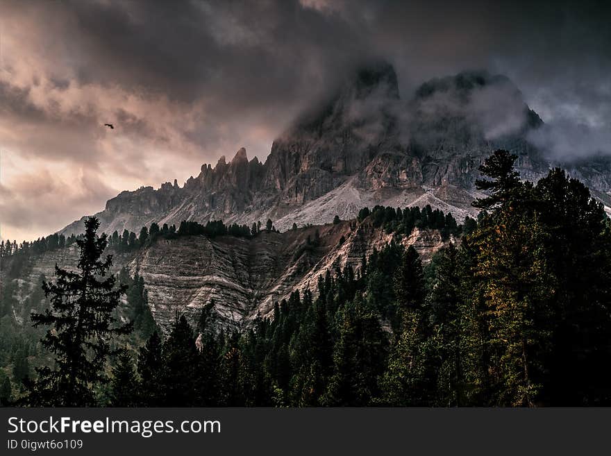 Photo of Mountain With Ice Covered With Black and Gray Cloud