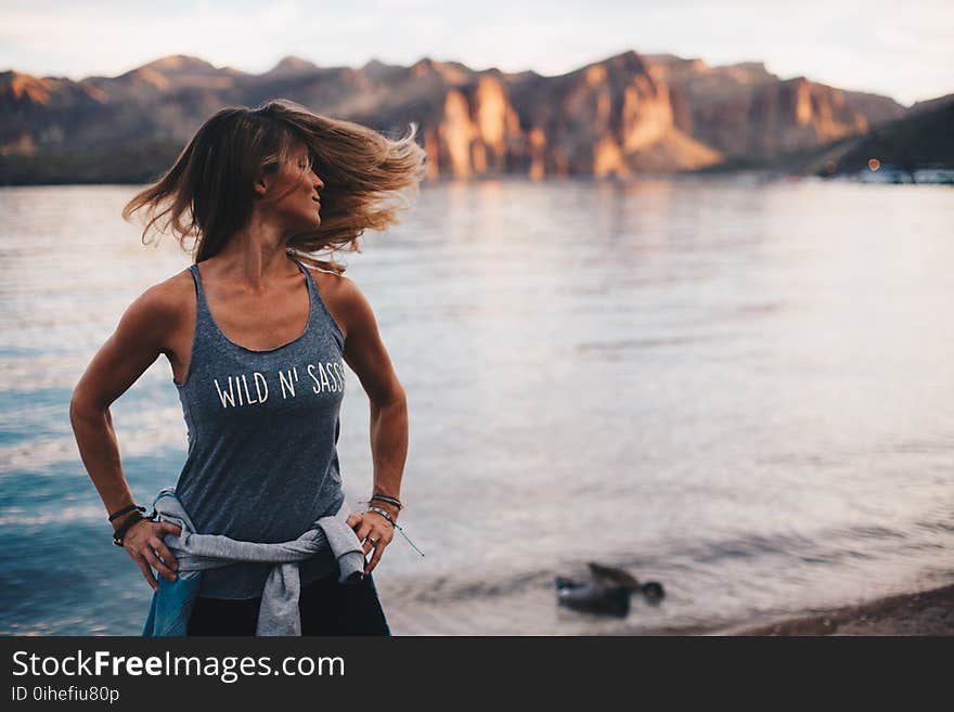 Woman Wearing Grey Wild &#x27;n Sassy Tank Top Near Body of Water