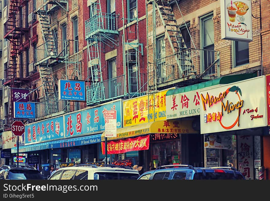 Different Store Signages on Brick Building