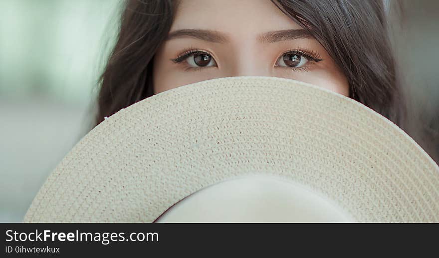 White Hat in Woman&#x27;s Face