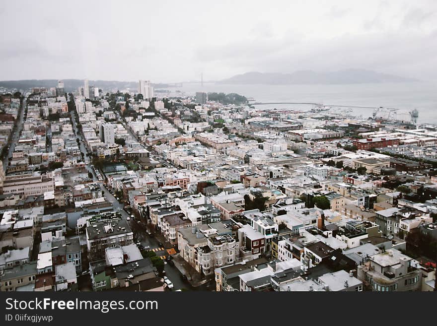 Aerial View of City Under Cloudy Sky