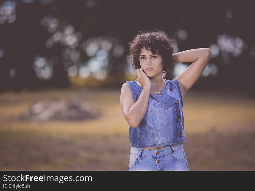 Woman Standing on Field Selective Focus Photography