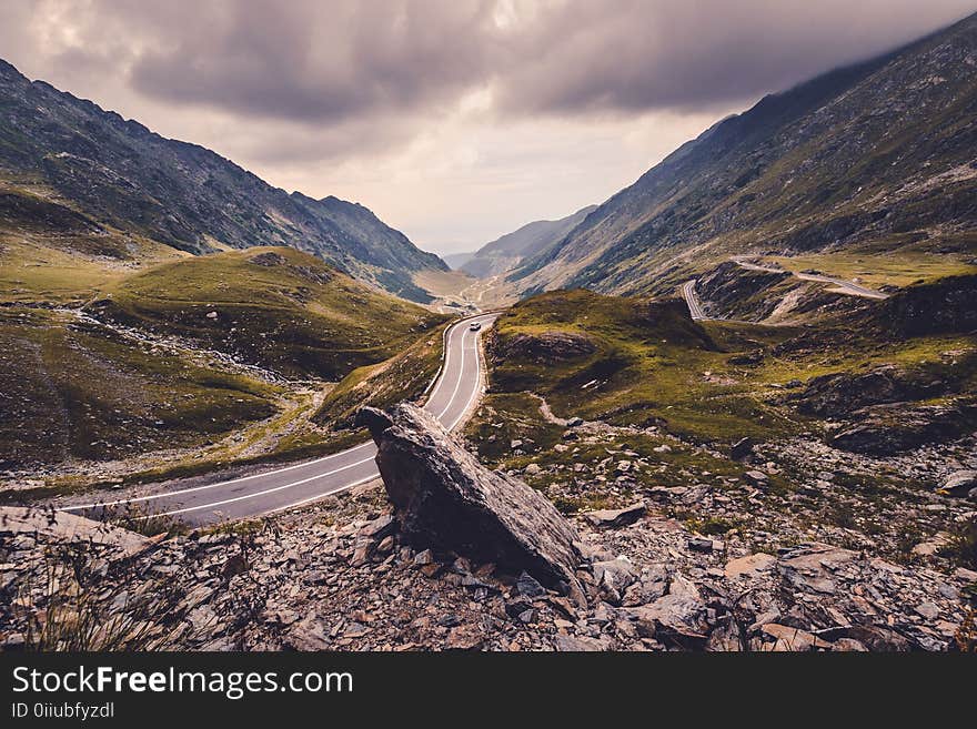 Black Car on Road Near Mountains