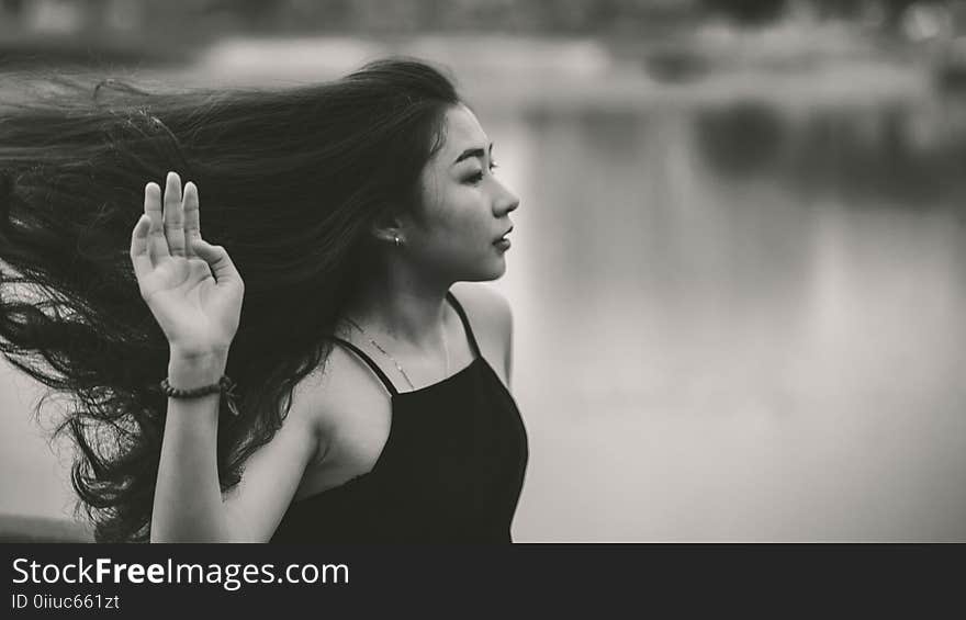 Grayscale Photo of Woman in Spaghetti Strap Top