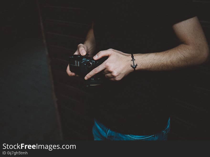 Photography of Man Holding Dslr Camera