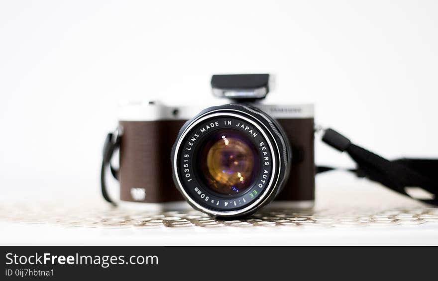 Black and Brown Dslr Camera