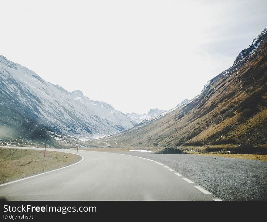 Gray Concrete Road Surrounded With Mountains