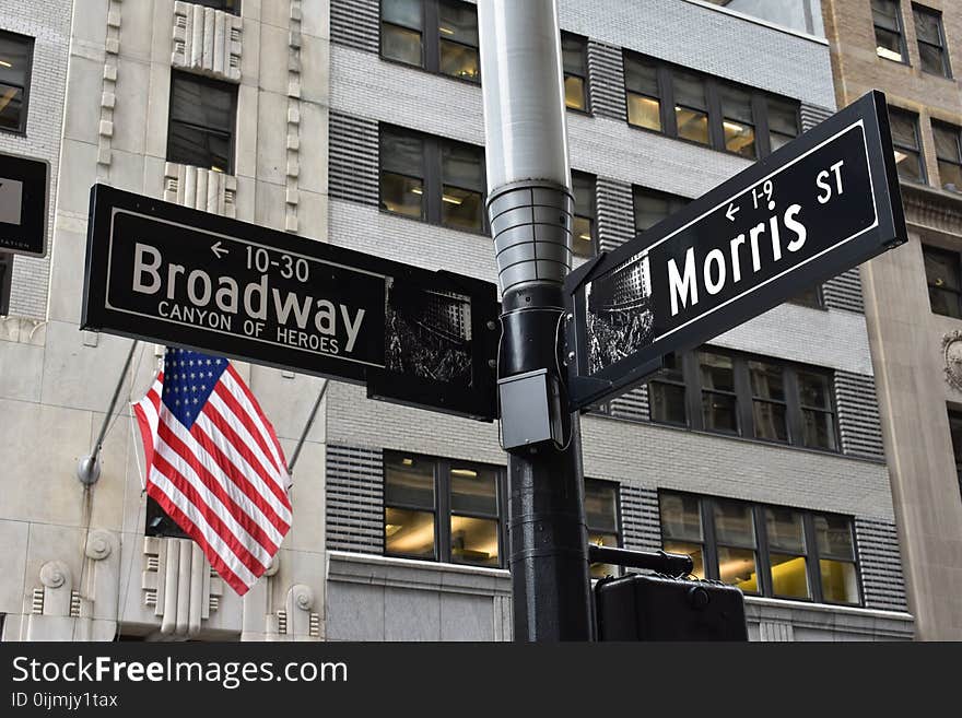 Grey and Black Broadway and Morris Street Signage Near U.s. Flag