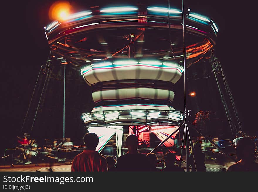 Silhouette Photography of People in Front of a Circus Ride