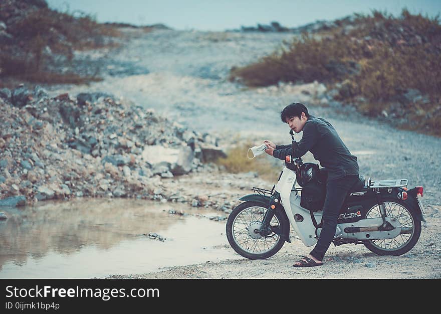 Man Riding a Motorcycle