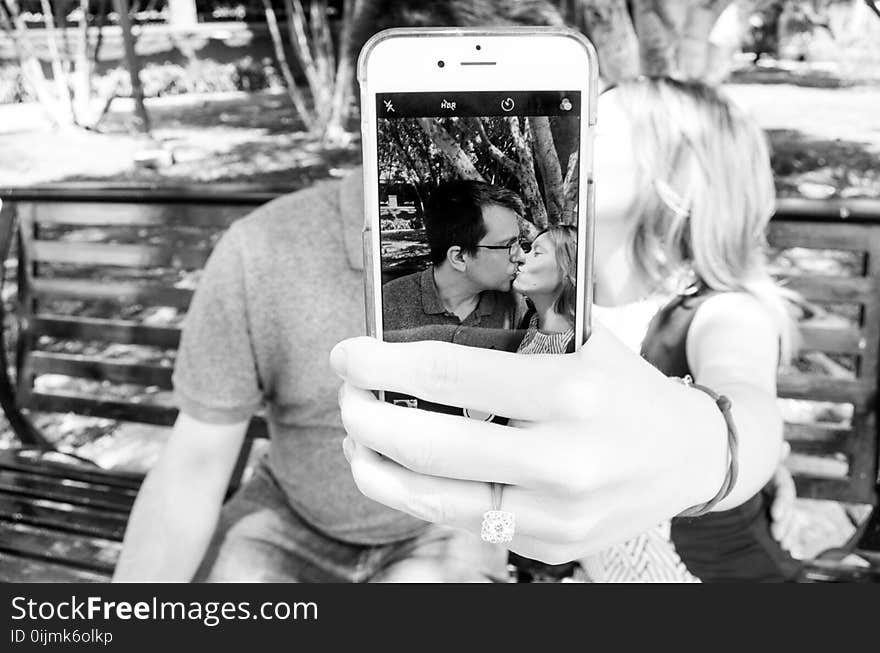 Gray Scale Photo of Man and Woman Taking a Selfie