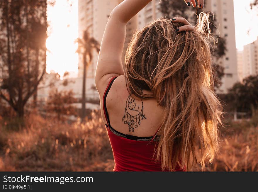 Woman Wearing Red Spaghetti Strap Top