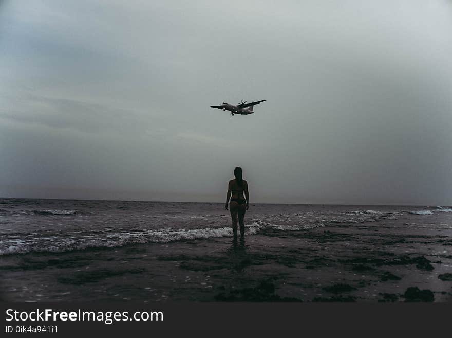 Grayscale Photography Of Woman On Seashore