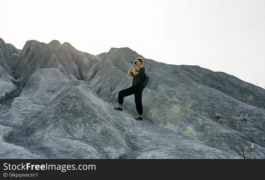 Woman Standing In Front of Mountain