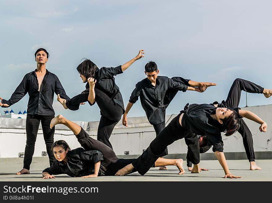 Persons in Black Shirt and Pants