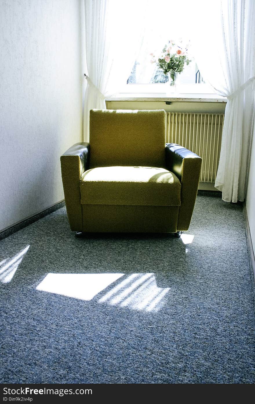 Beige Fabric Sofa Near White Window With Bundle of Flower during Daytime