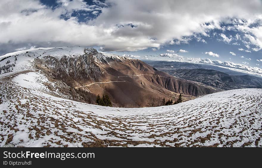 Landscape Photo of Snowy Mountain Under Cloudy Sky