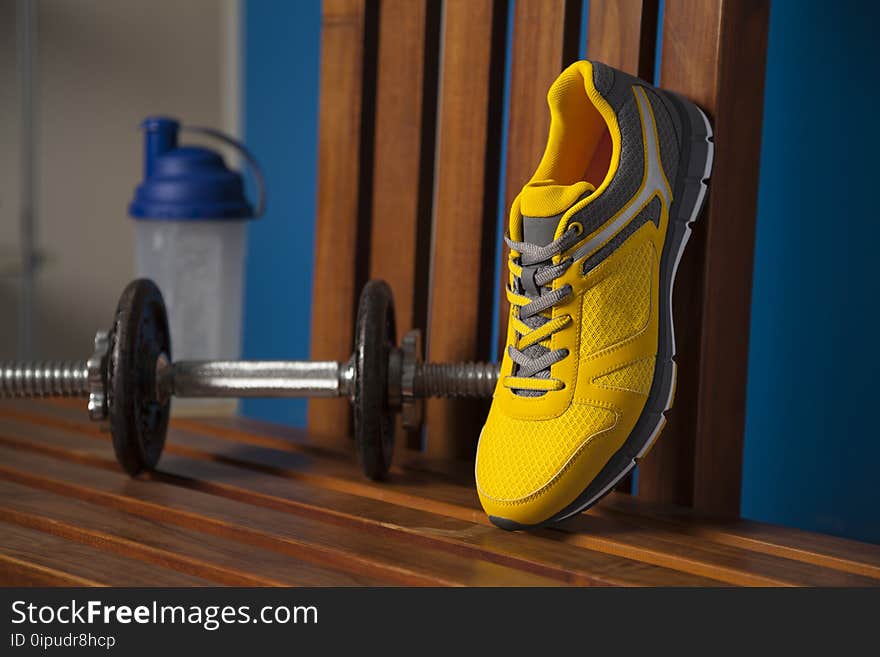 Yellow sneakers on fitness table